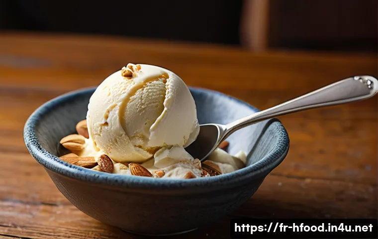 비건 아이스크림 브랜드 비교 - A close-up image of a creamy vegan ice cream scoop made from cashew milk, showcasing a smooth and ve...